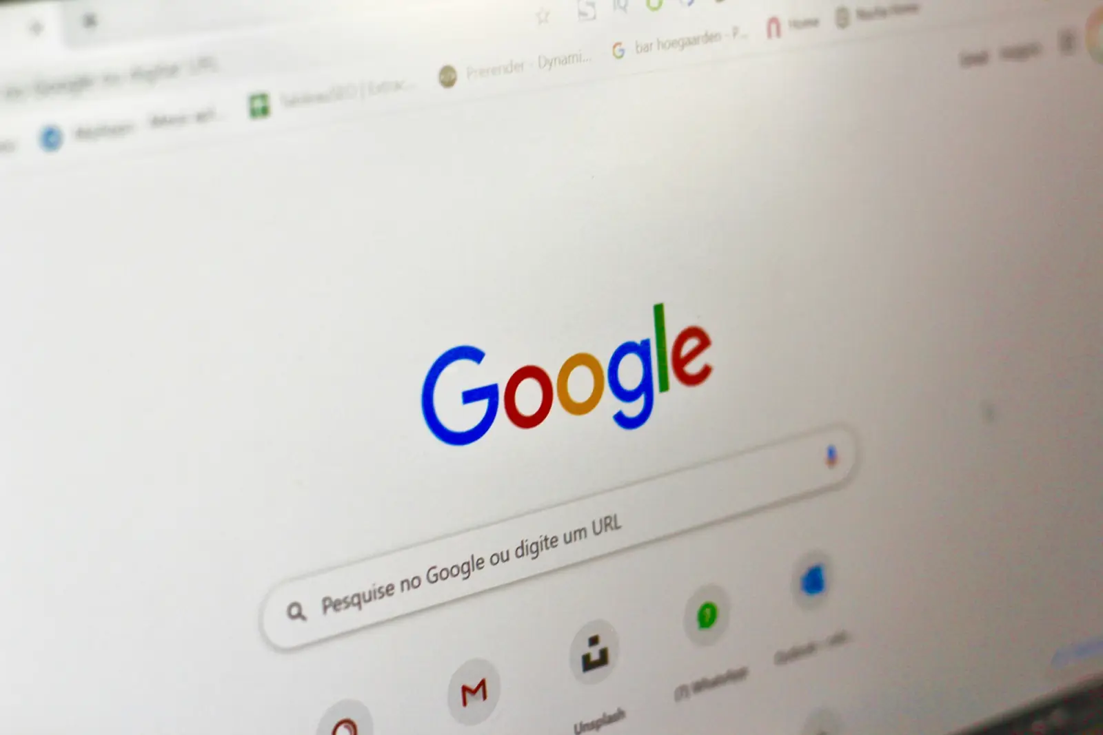 A laptop screen open on the Google search page, ready for a query