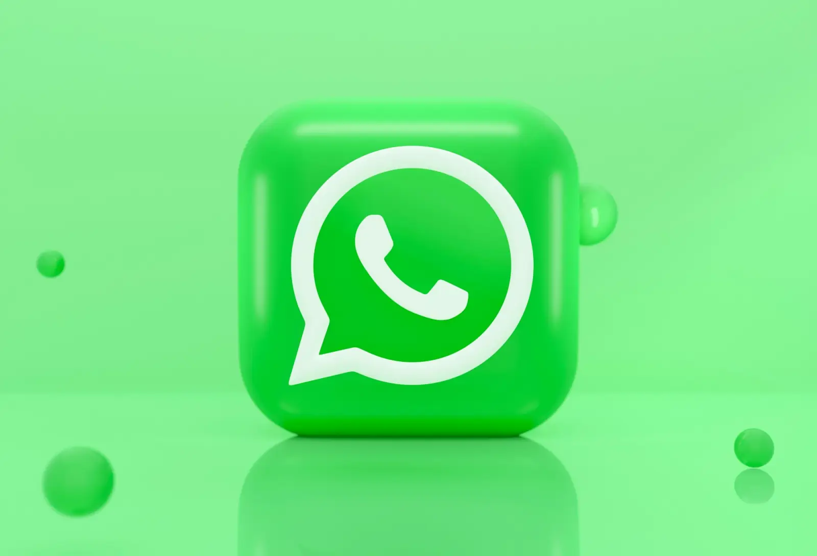 A green WhatsApp icon inside a speech bubble on a soft green background